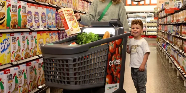 a family shops in a grocery store using a smart trolley 768x384