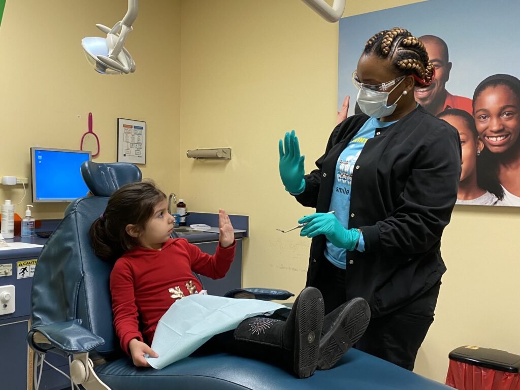 child high fives dentist scaled 1 1024x768