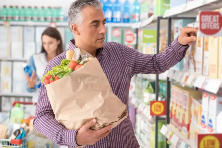 man shopping supermarket doing grocery searching products store shelf holding bag fresh vegetables 80943021 1 768x513