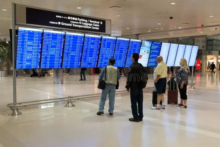 passengers checking flight schedule airport detroit michigan usa may group departures board terminal hall 118159830 768x513